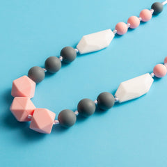 QIMGIC teething necklace green-white style1 supports sensory exploration.