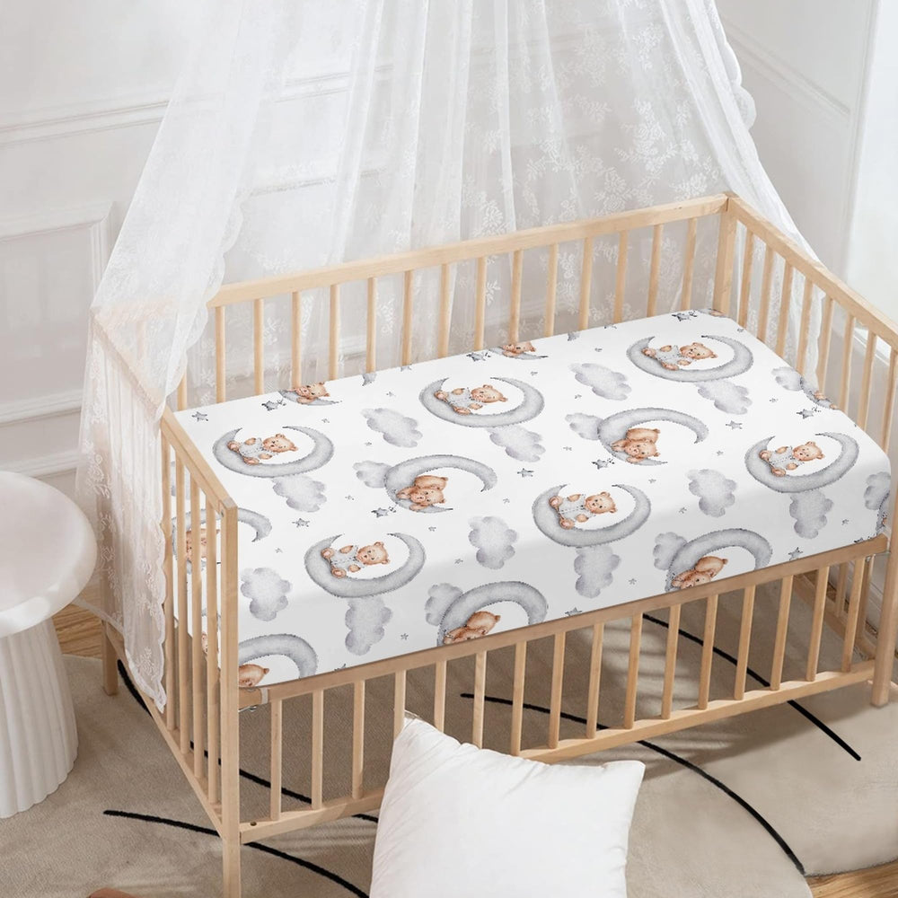 QINBEIDU gray crib sheet with elastic edges ensures secure, wrinkle-free fit.