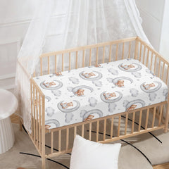 QINBEIDU gray crib sheet with elastic edges ensures secure, wrinkle-free fit.