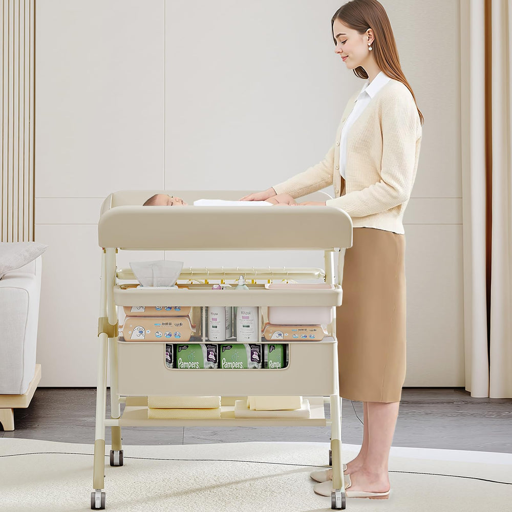 QMHHRJT foldable portable changing table beige wheels move smoothly for room-to-room changes.