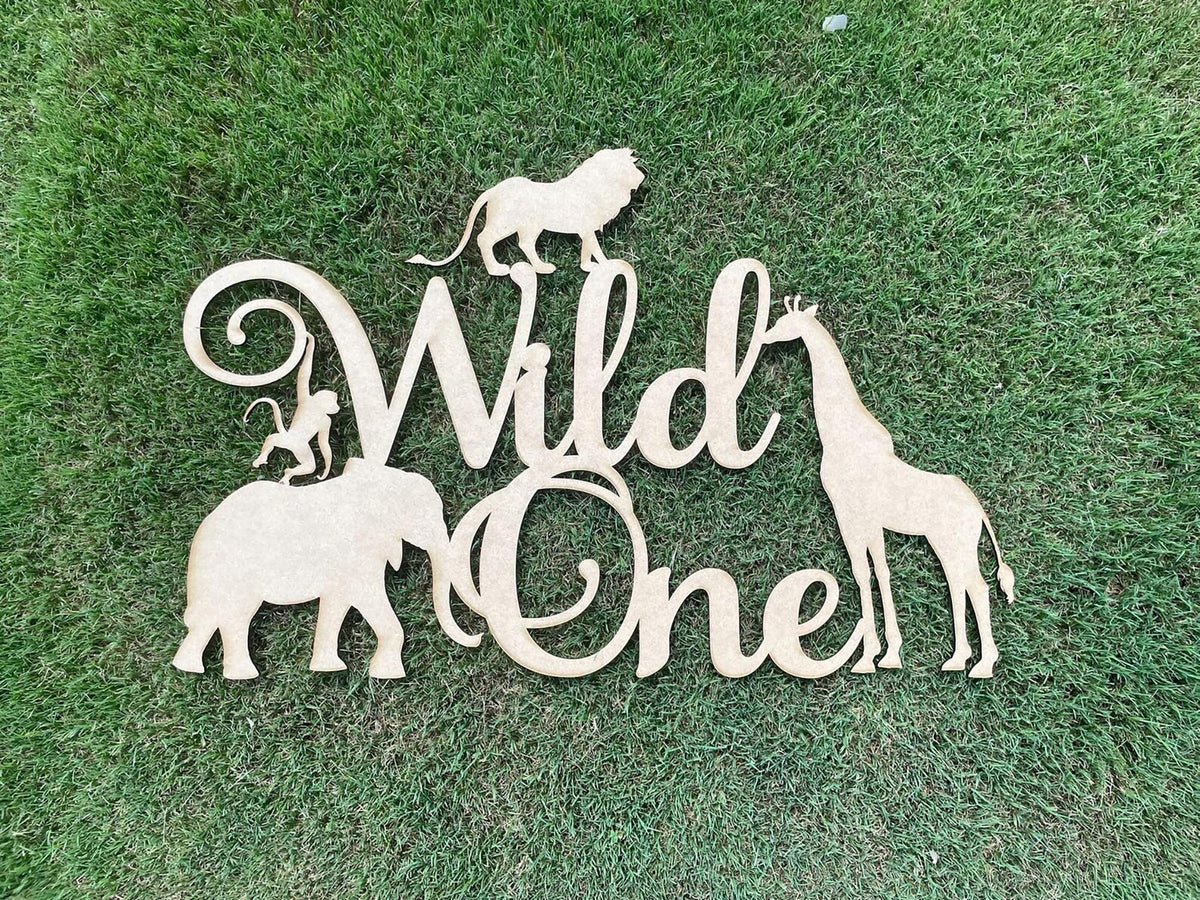 QPARTYFIRE Wild One sign backdrop on wood for safari-themed parties.