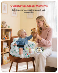 QPAU inflatable baby seat in use with the green dinosaur pattern during feeding