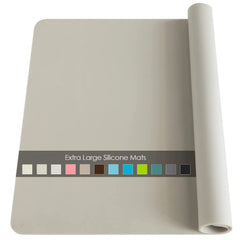 QPix Digital extra-large silicone table mat protects countertops from heat and spills during cooking.