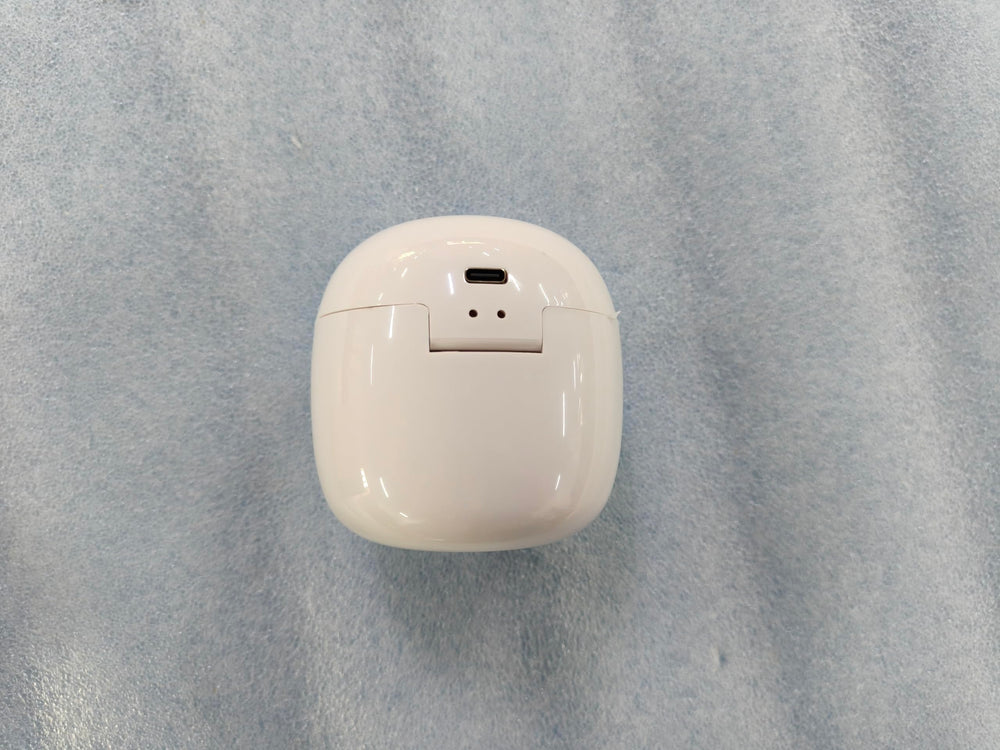 Qualirey pacifier on table demonstrates convenient cleansing between uses.