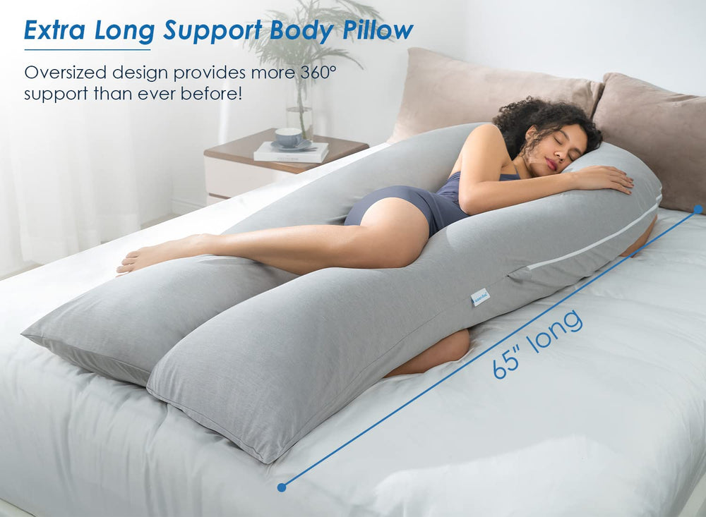 QUEEN ROSE U-shaped pillow on bed providing head-to-toe support.