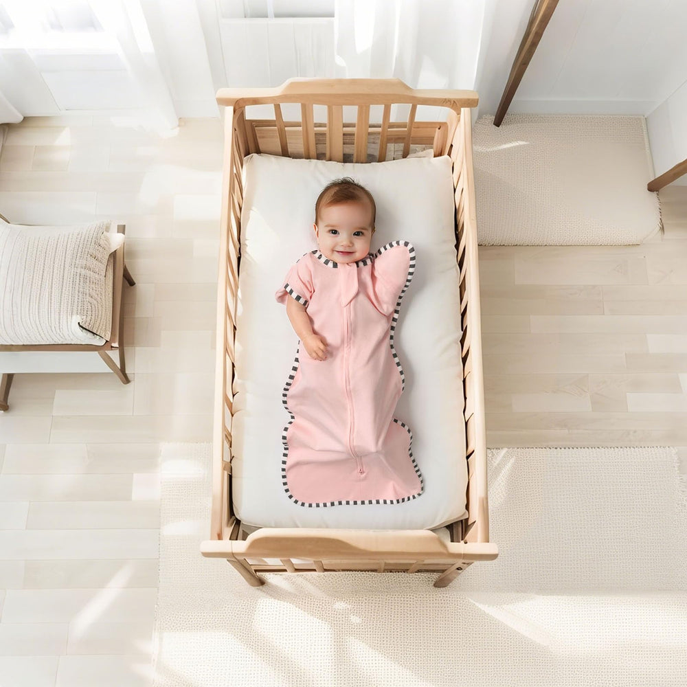 QUENESS Arm-up cuffs swaddle highlights range of motion for easier night sleep.