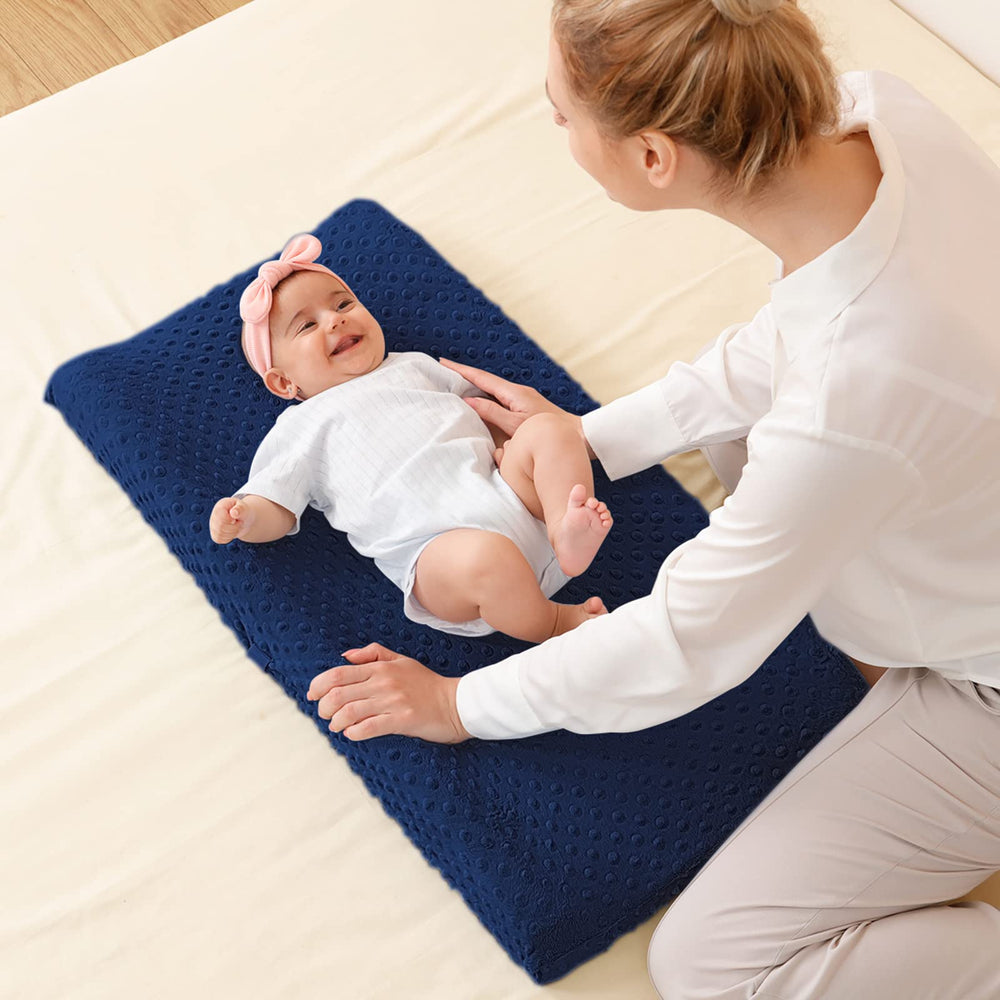 QUENESS Baby Changing Pad Cover Estate Blue on changing table shows cozy comfort.