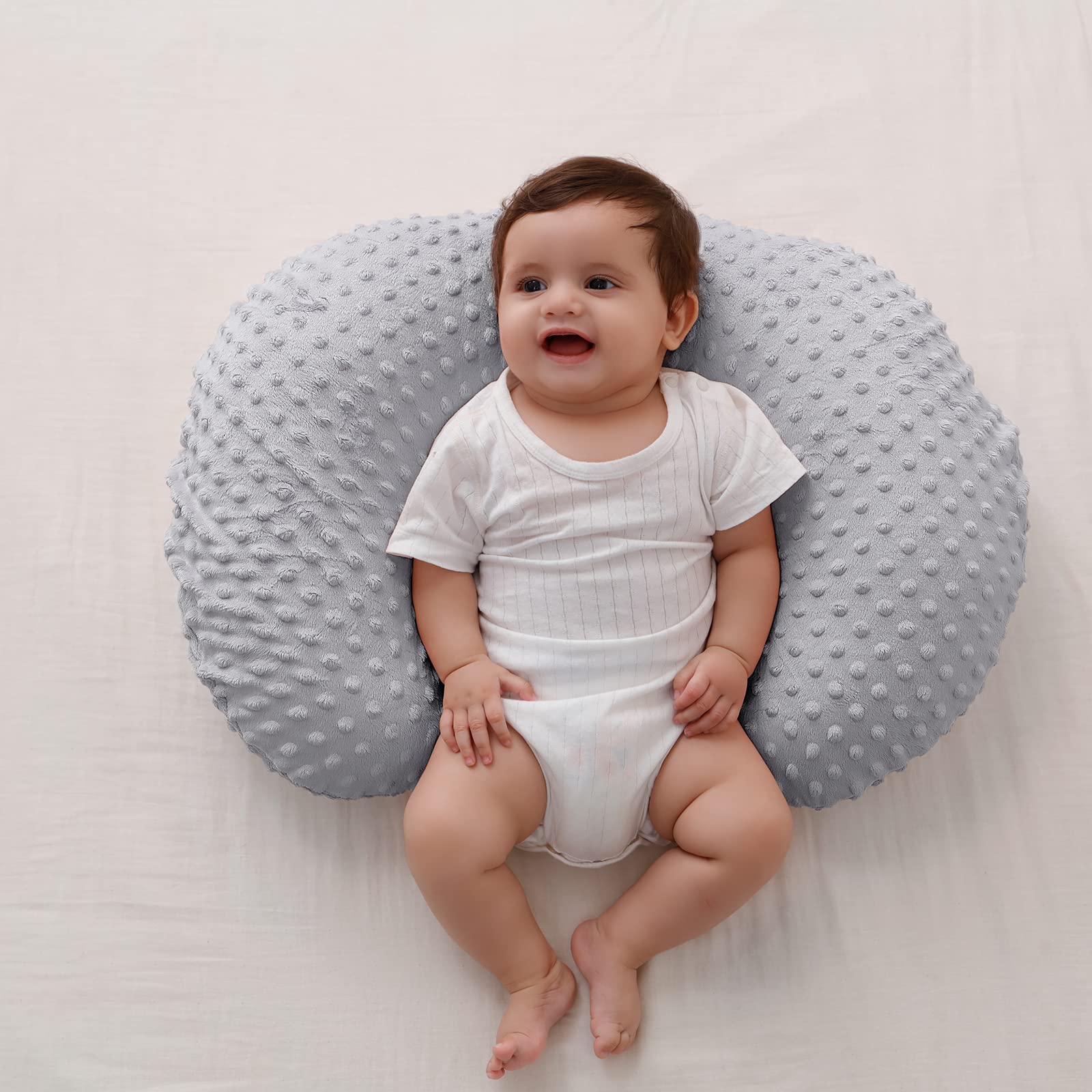 QUENESS BABY nursing pillow gray side angle shows ergonomic support during feeding