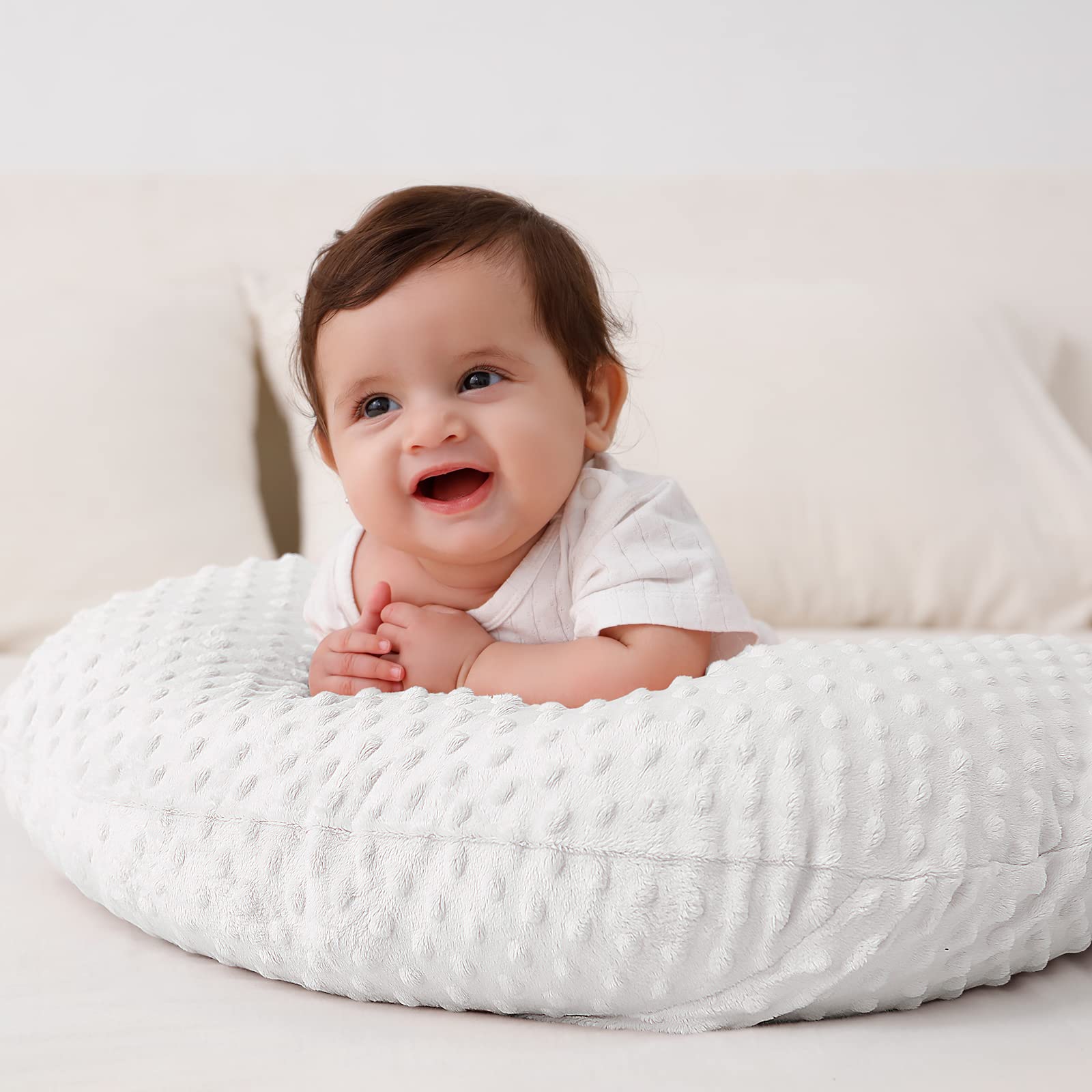 QUENESS BABY nursing pillow machine washable cover for easy care.