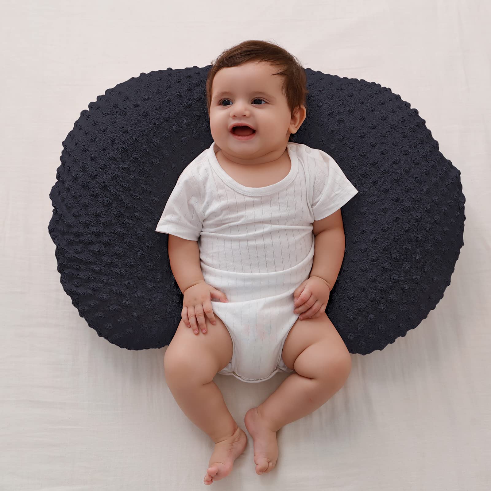 QUENESS BABY nursing pillow tummy time support demonstrates gentle elevation for play