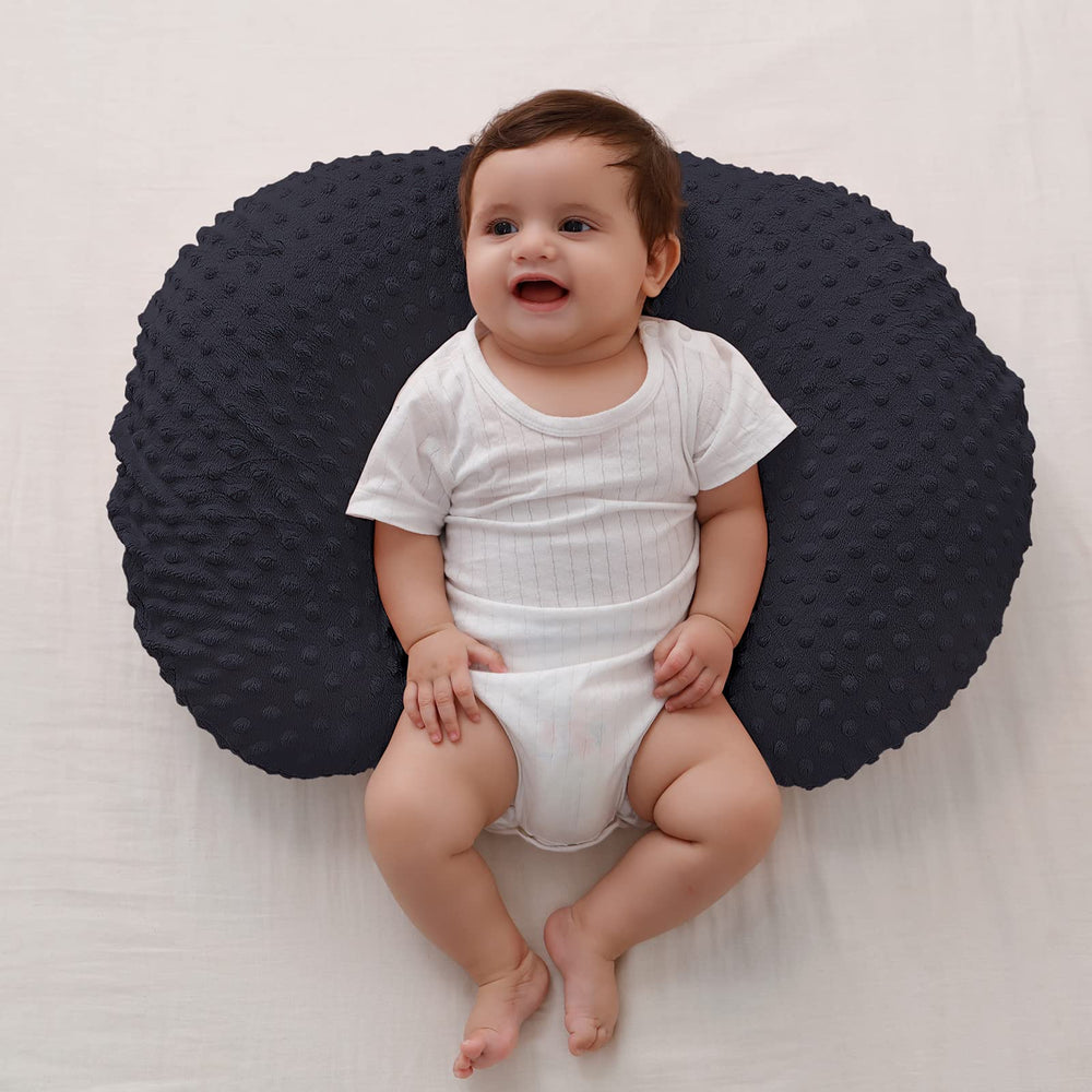 QUENESS BABY nursing pillow tummy time support demonstrates gentle elevation for play