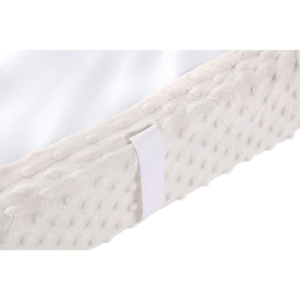 QUENESS beige waterproof back helps keep the changing pad dry after messes