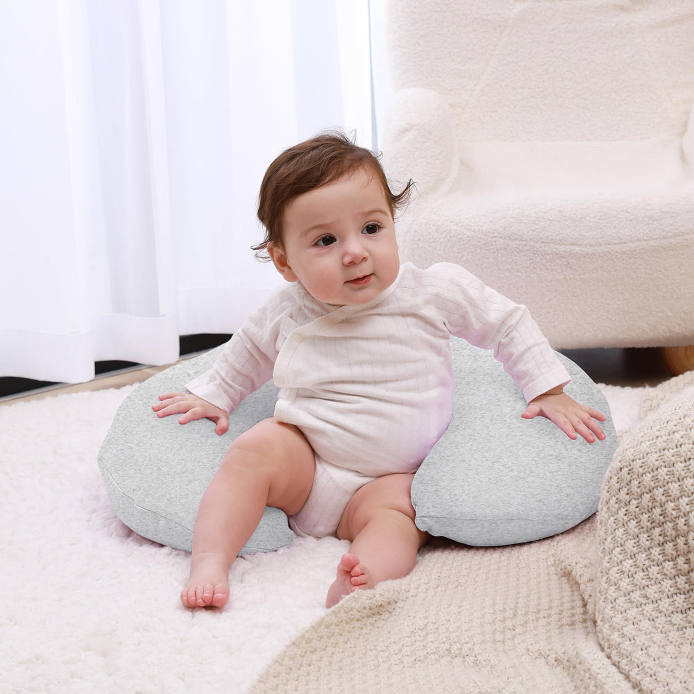 QUENESS nursing pillow demonstrates arm support during feeding for reduced fatigue