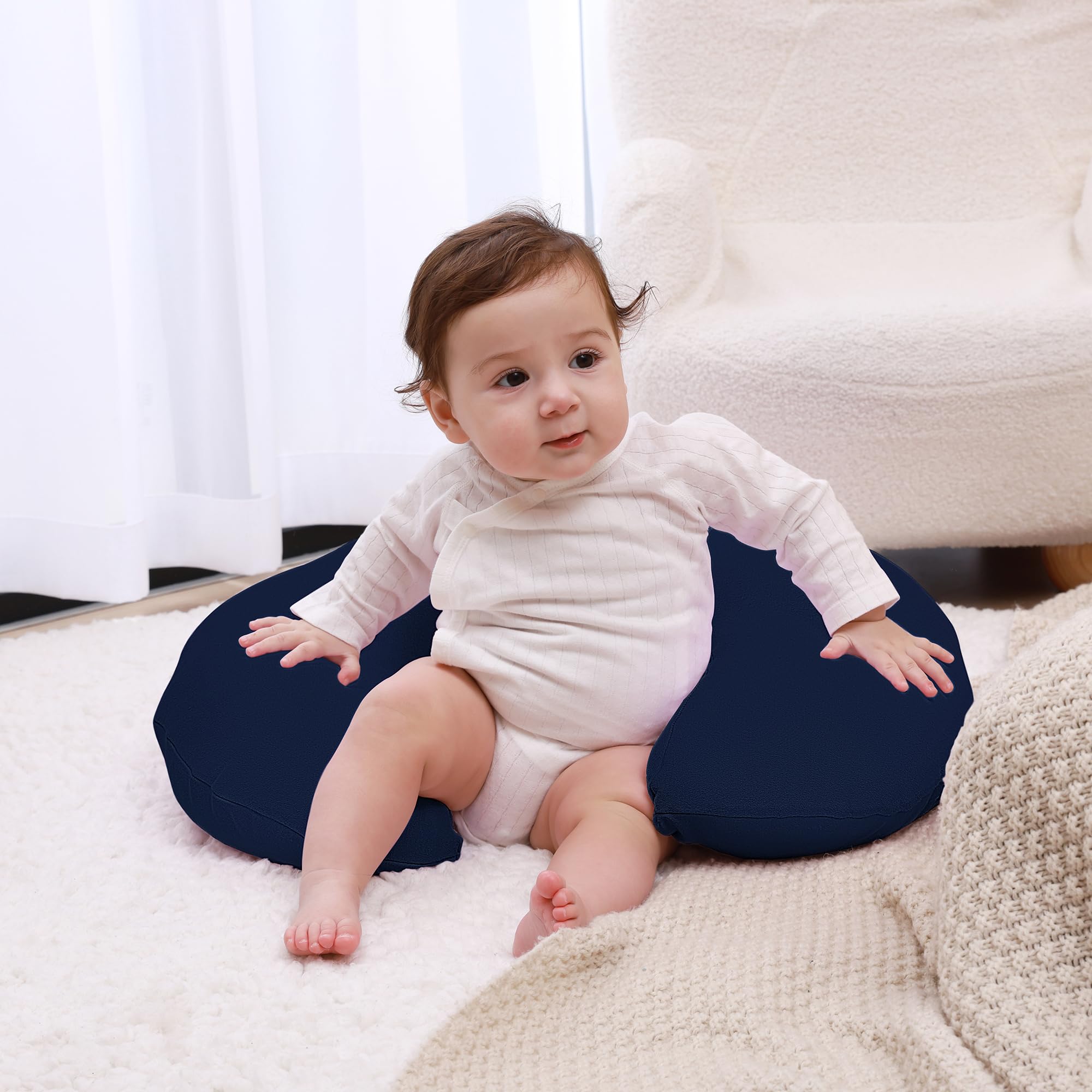 QUENESS nursing pillow with baby demonstrates comfortable feeding position