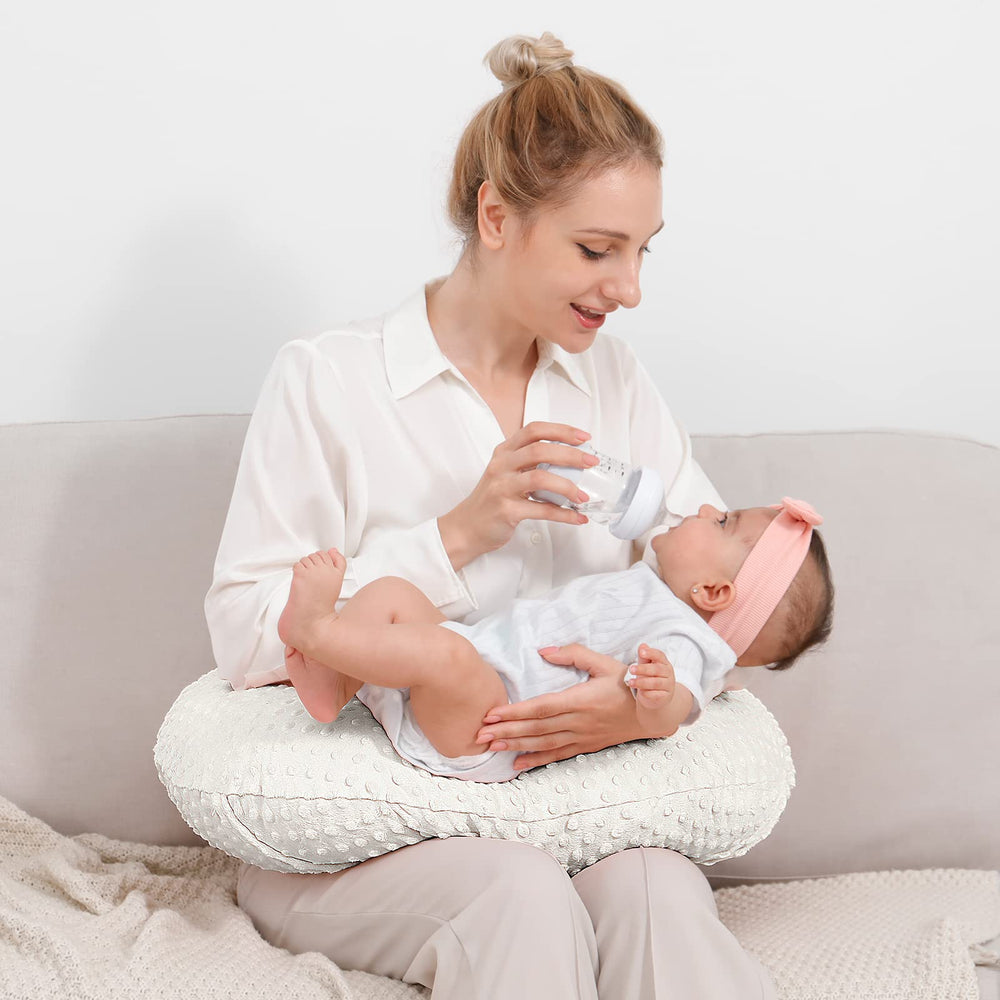QUENESS Nursing Pillow beige tummy time support for safe play.