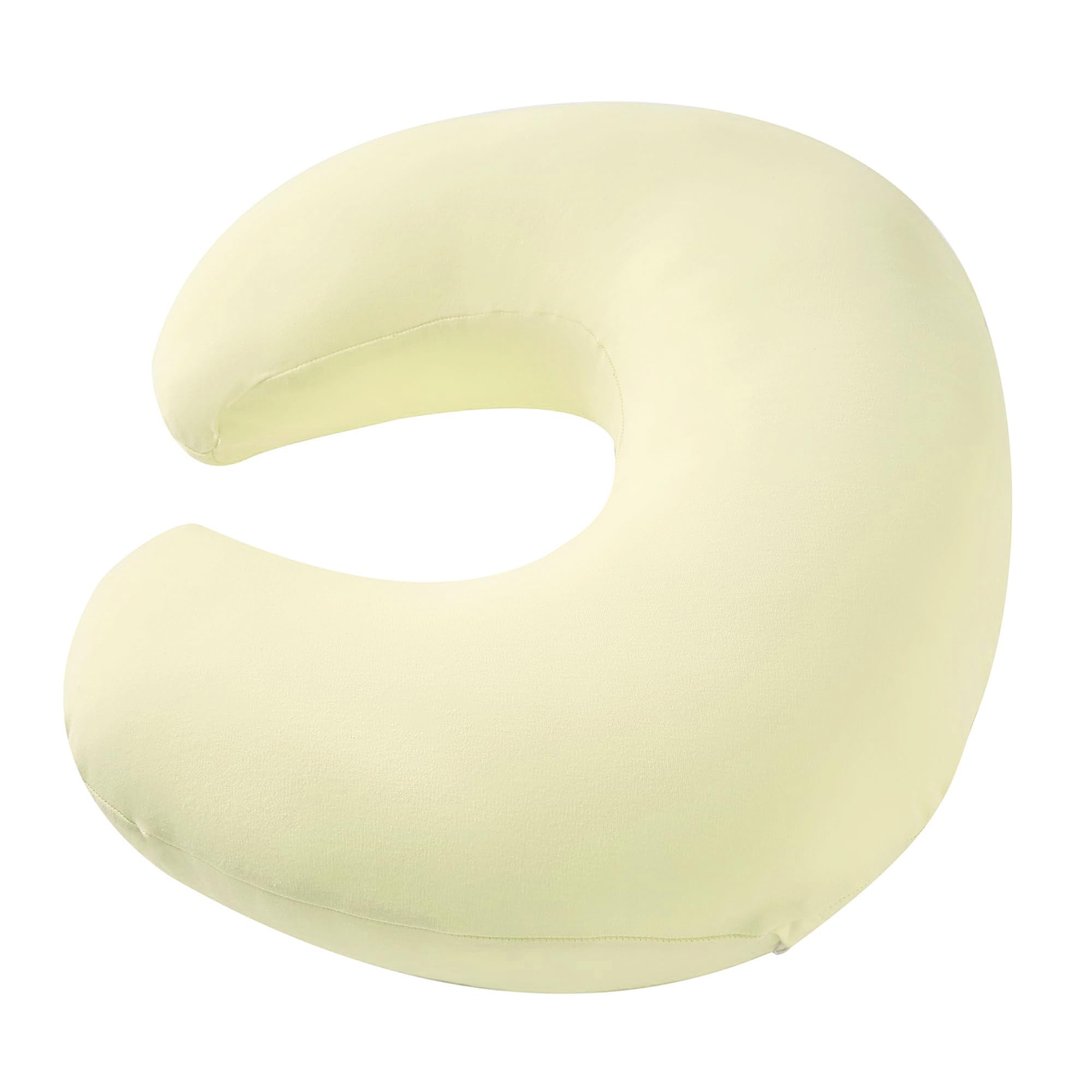 QUENESS Nursing Pillow dimples help keep baby secure during feeding.