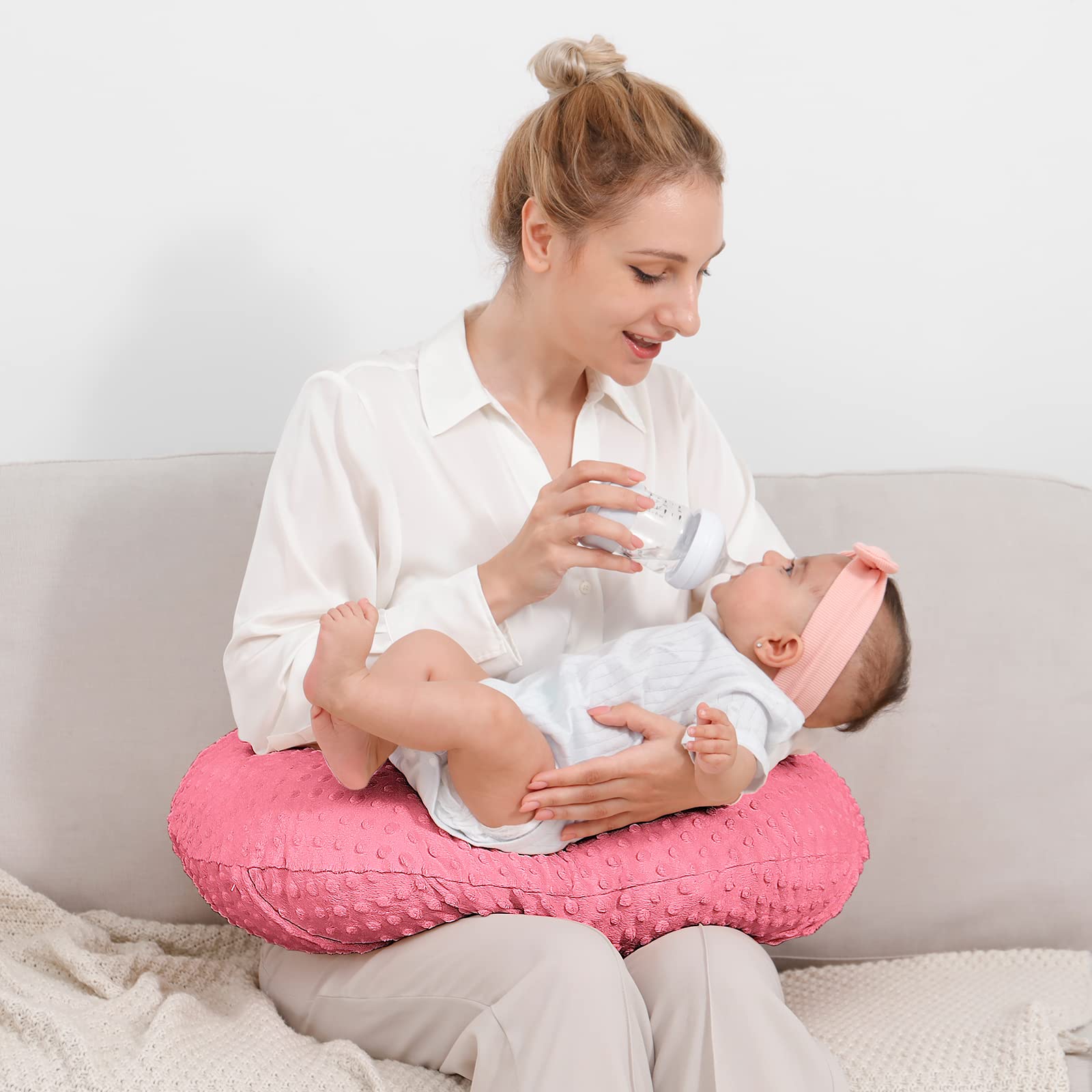 QUENESS nursing pillow on lap supports easy feeding and reduced arm fatigue