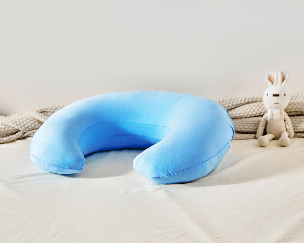 QUENESS nursing pillow for multiple ages from newborn to toddler-friendly positions.