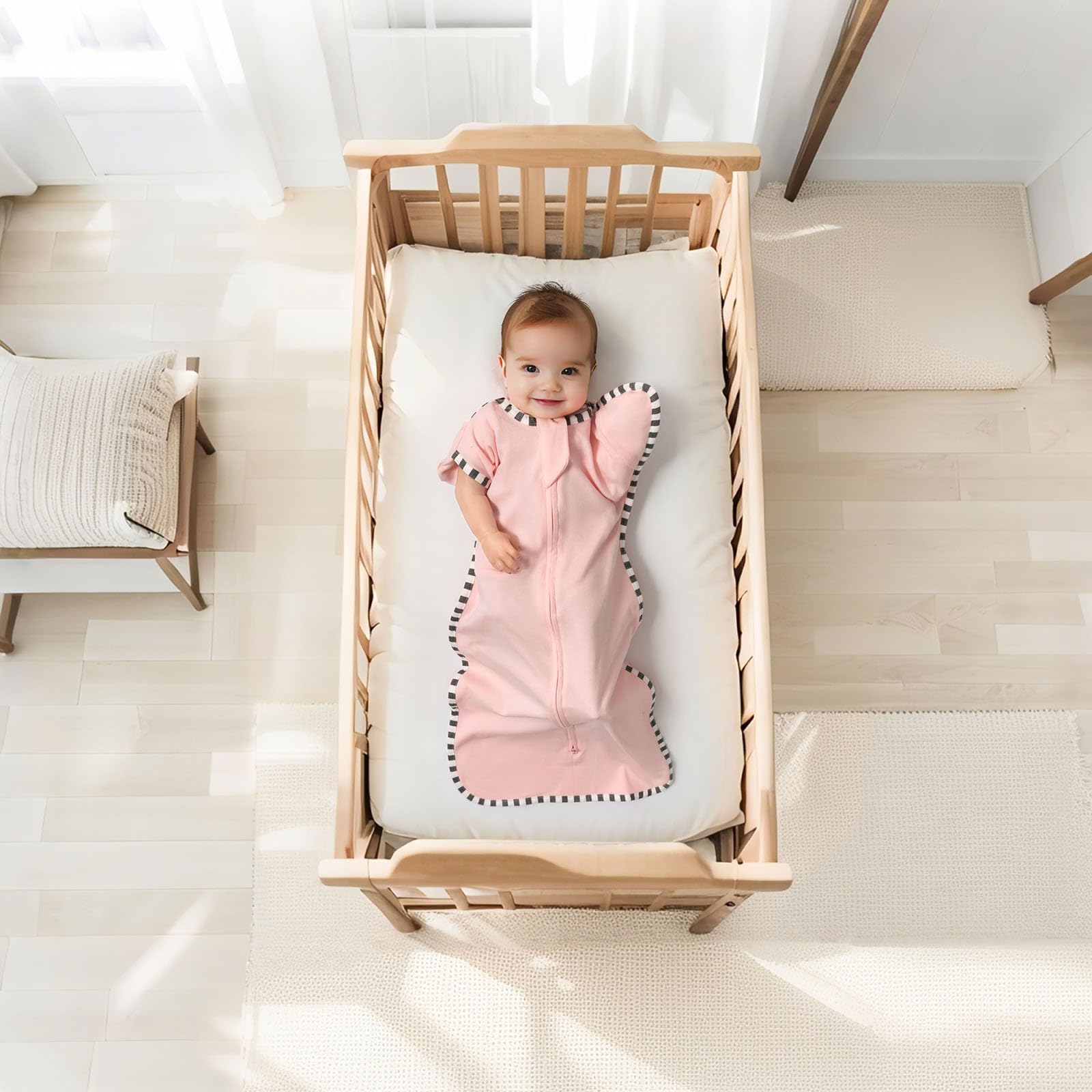 QUENESS Transition Swaddle arm-up mitten design supports easier transition to arms-free sleep.