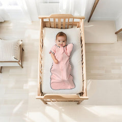 QUENESS Transition Swaddle arm-up mitten design supports easier transition to arms-free sleep.