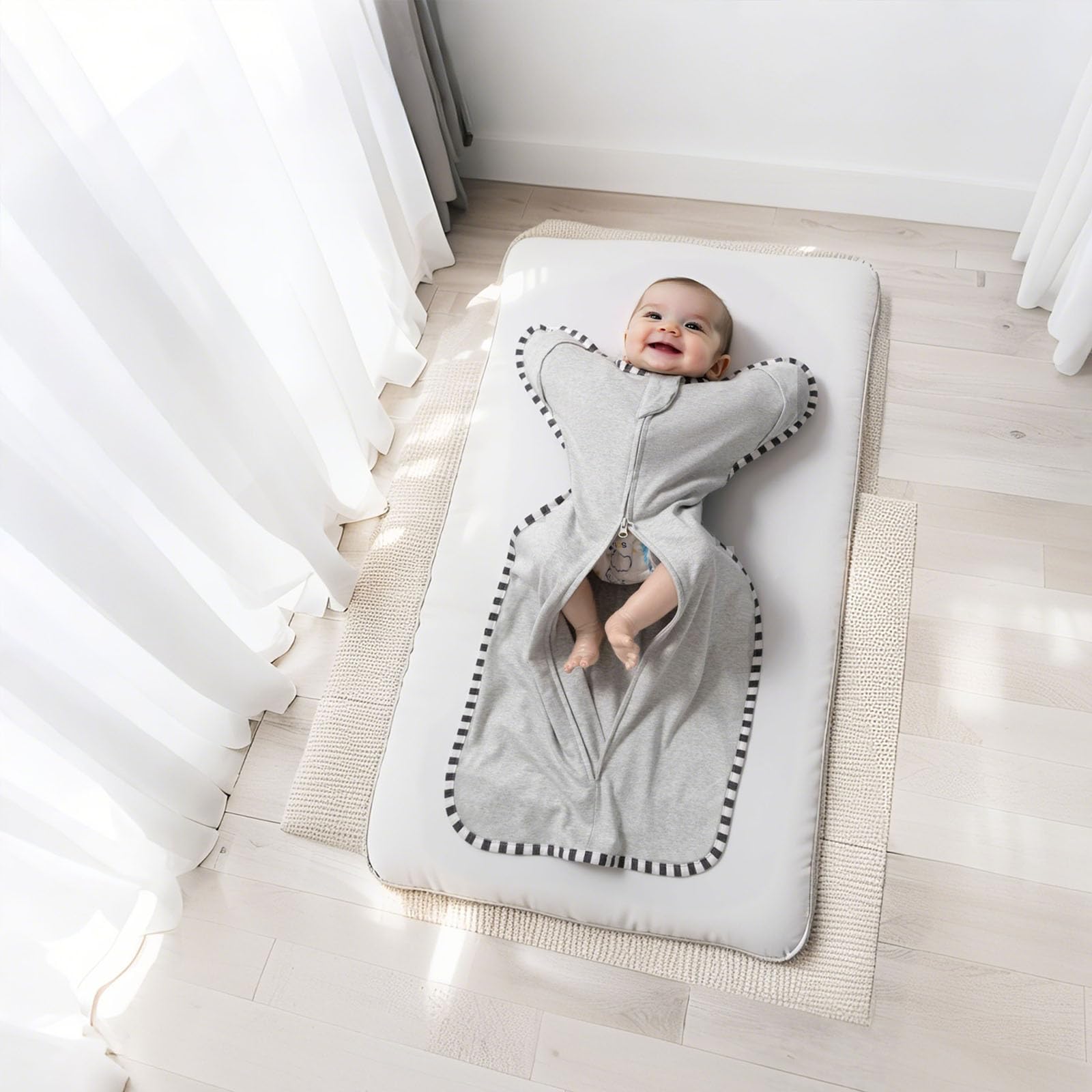 QUENESS Transition Swaddle baby sleeping peacefully in lightweight cotton