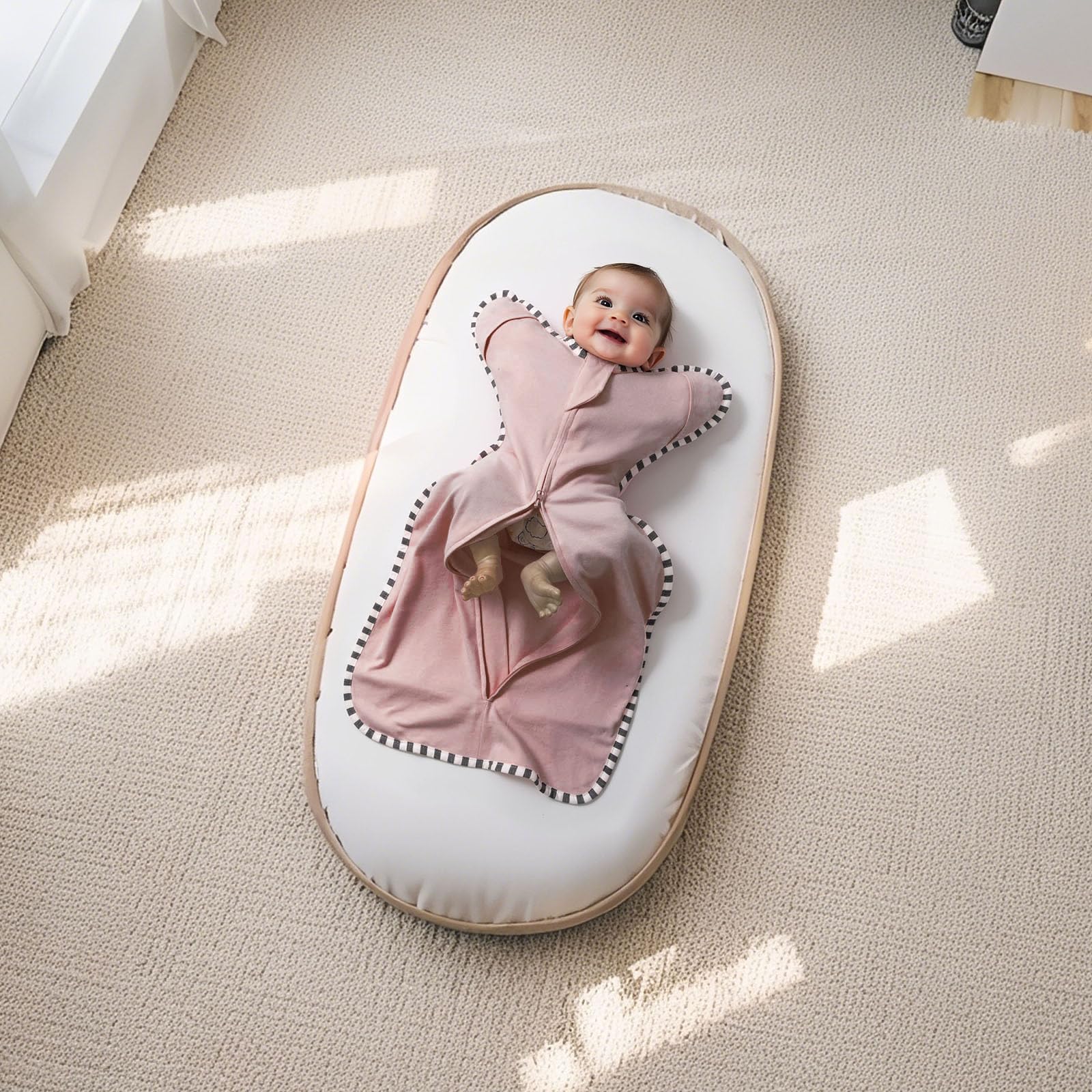 QUENESS Transition Swaddle newborn sleeping scene in two colors.