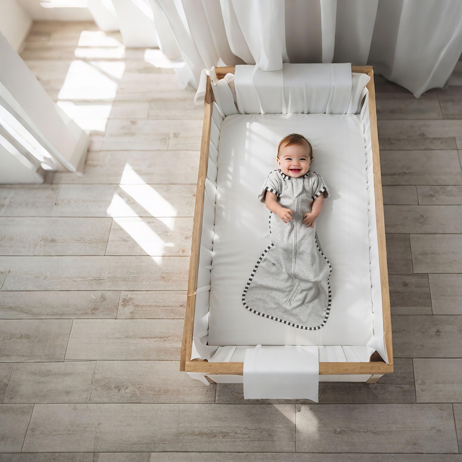 QUENESS Transition Swaddle packaging image shows gift-ready nursery essential.