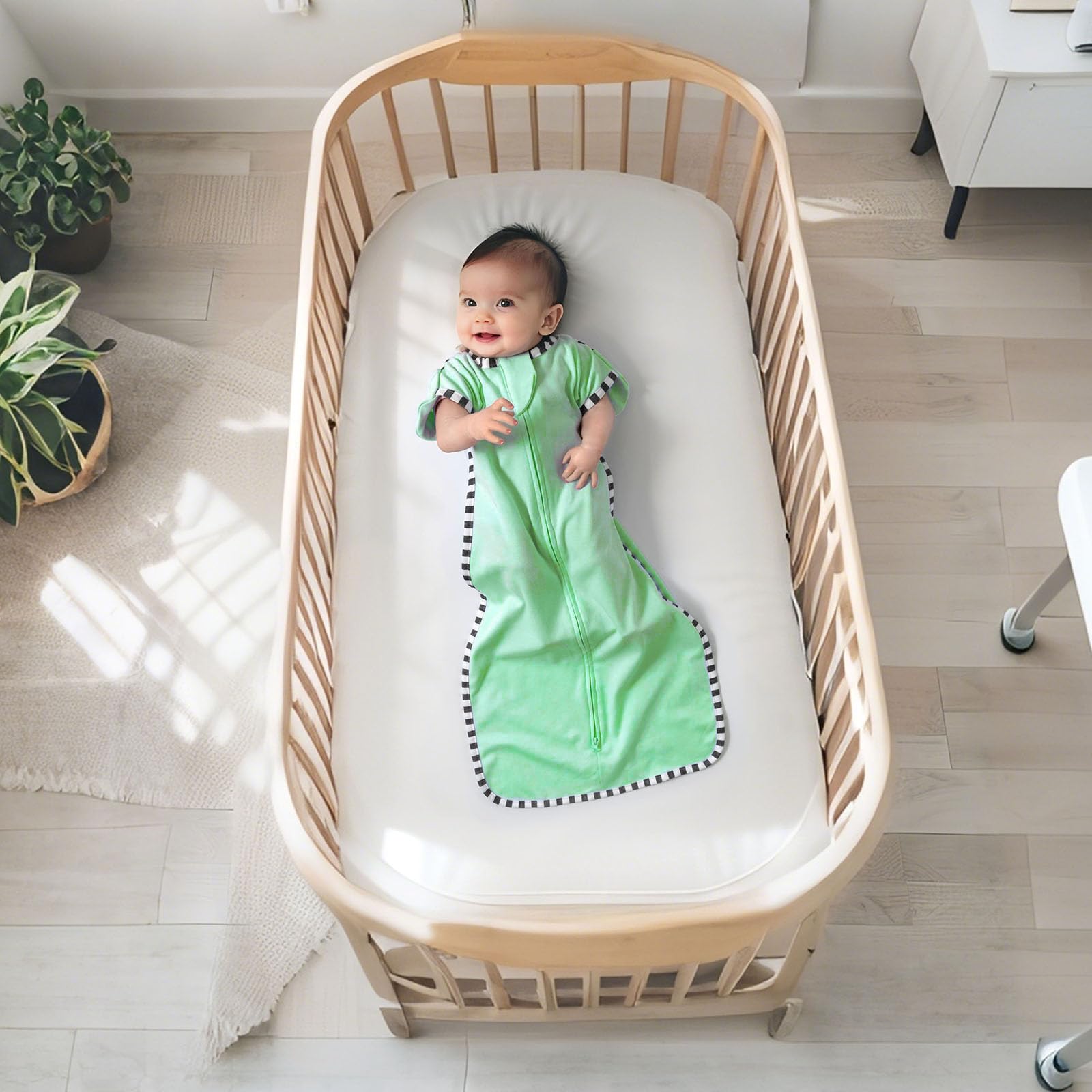 queness transition swaddle soft cotton weave emphasizing breathable warmth for newborns