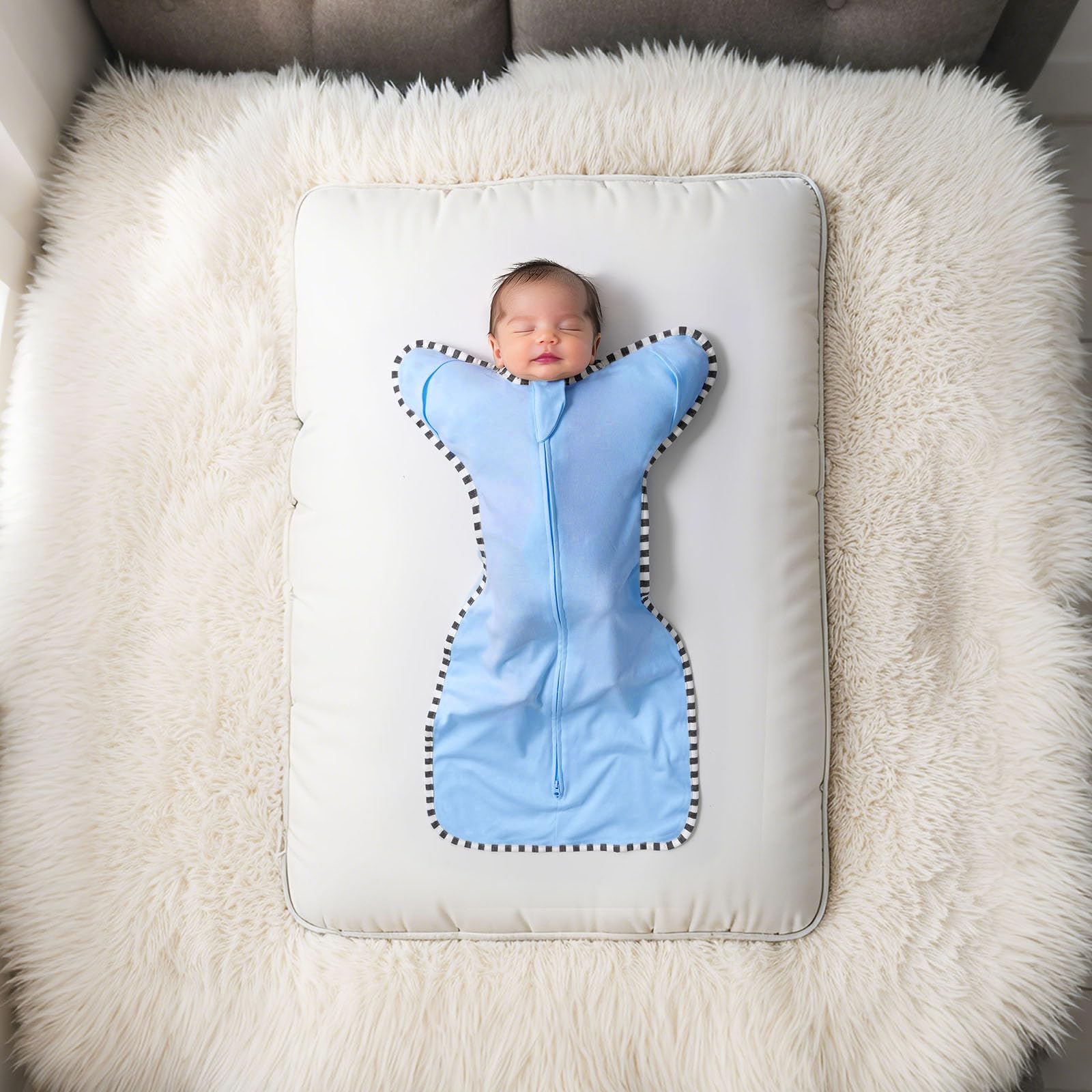 Queness Transition Swaddle two-way zipper with protector for easier diaper changes.