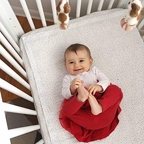 QuickZip standard crib fit demonstrated on a 52x27 inch mattress.