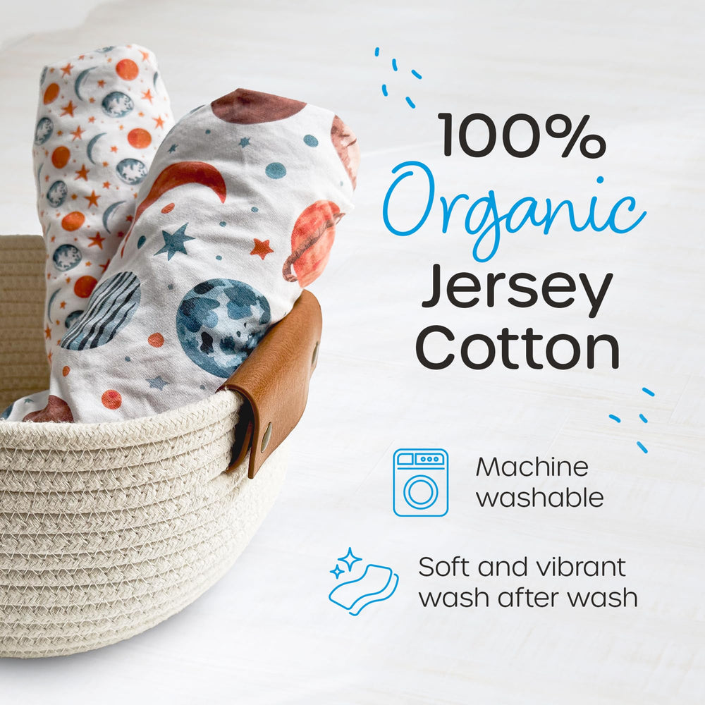 Quiggly travel crib sheets in planet pattern add playful decor while keeping baby cozy.