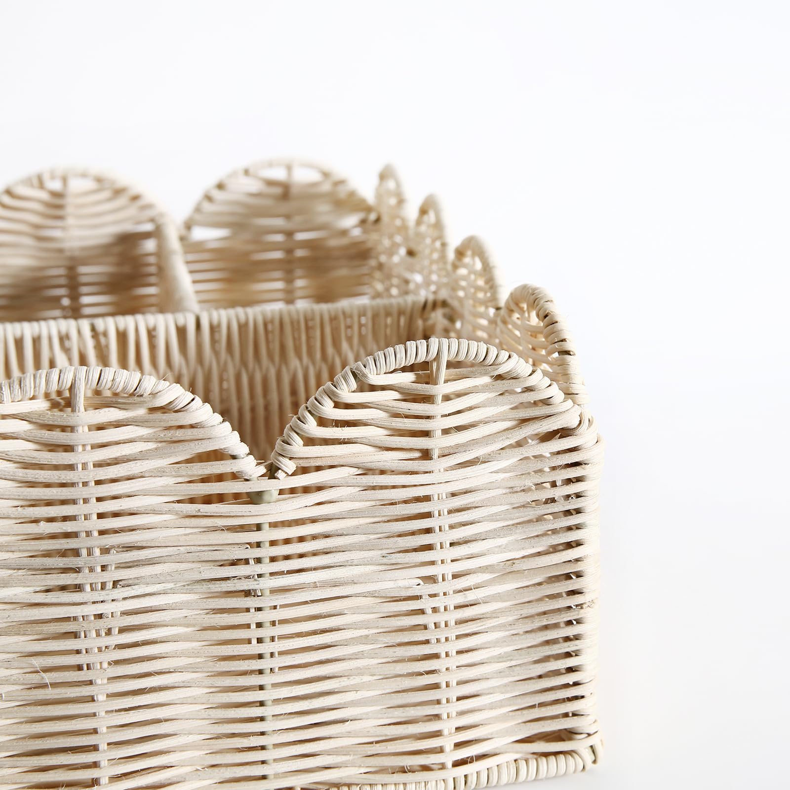 Quincry rattan diaper caddy with four compartments for wipes and creams.