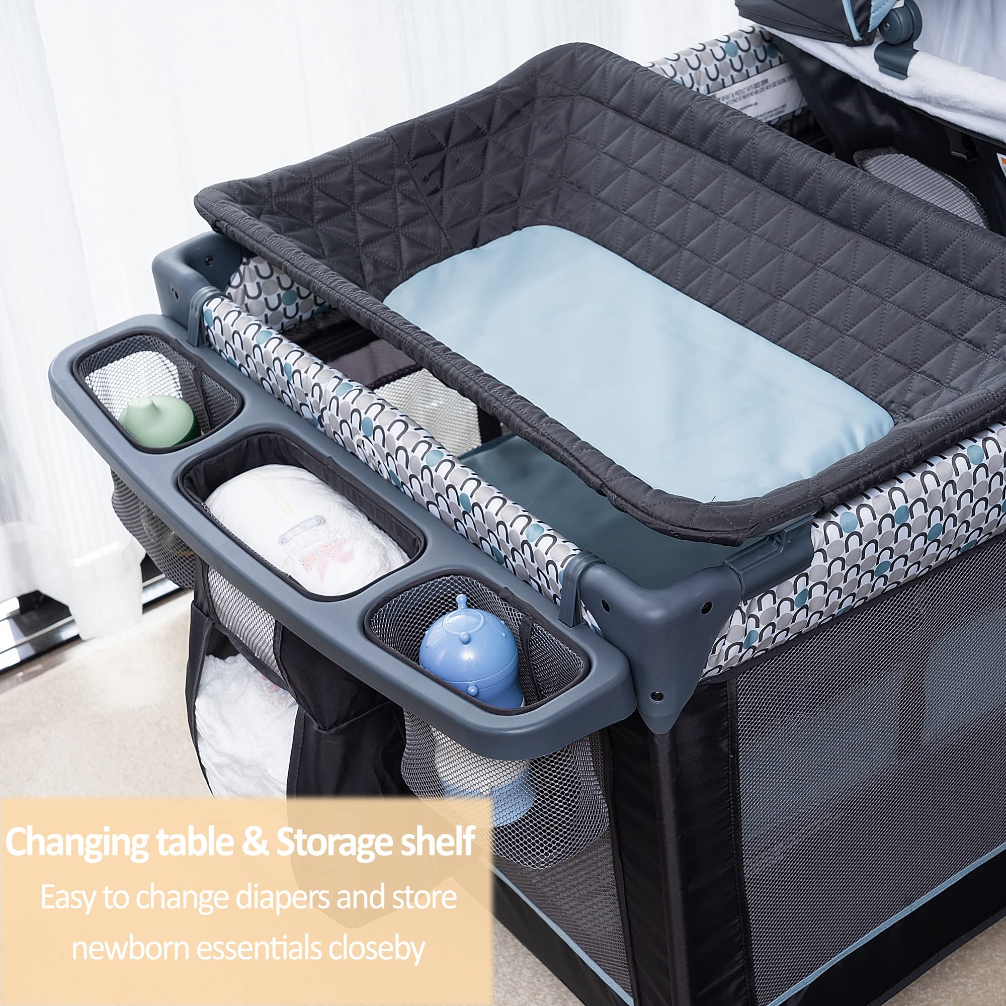 QUTANIX newborn napper with canopy offers shaded daytime naps.