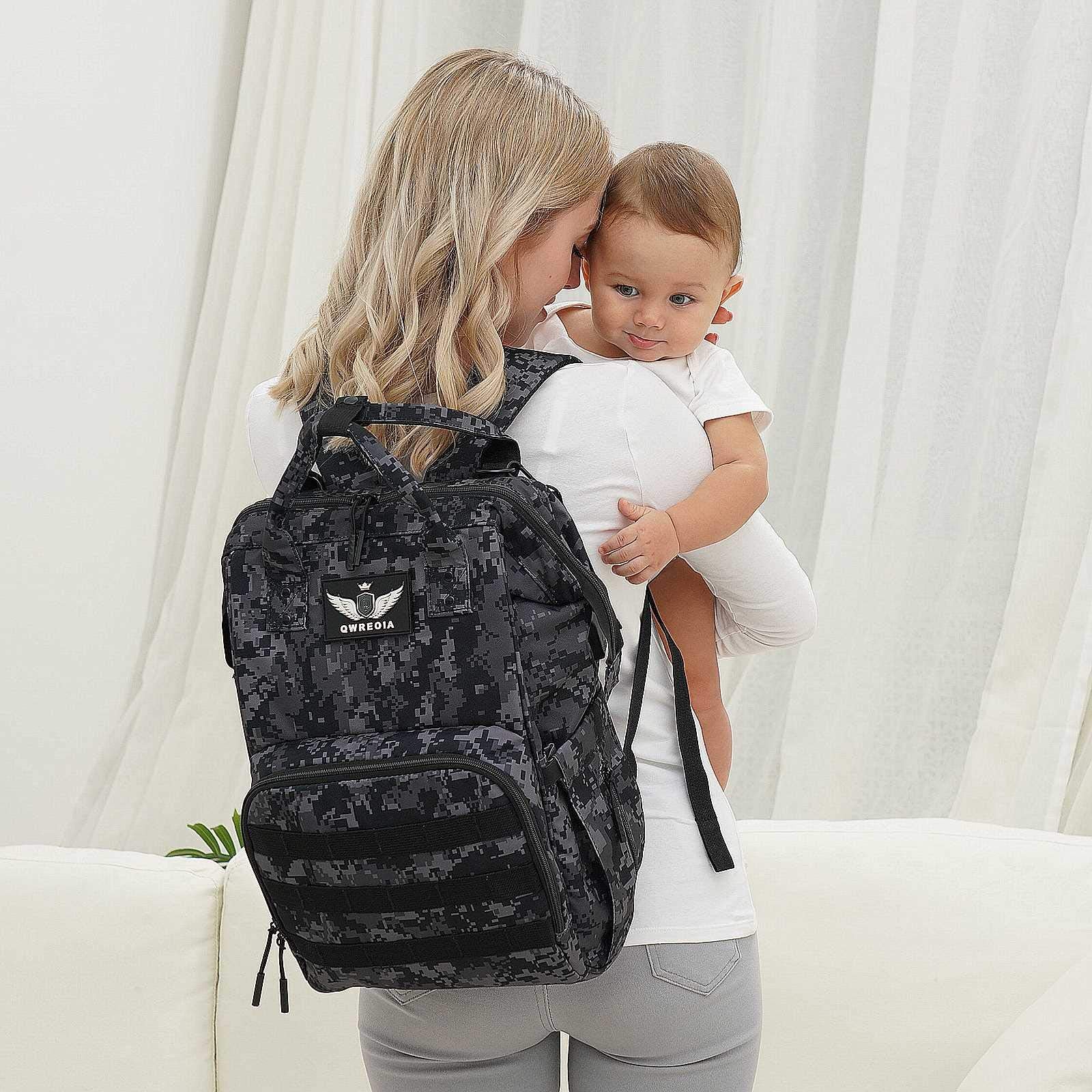QWREOIA diaper bag backpack worn as backpack or tote for versatile carry