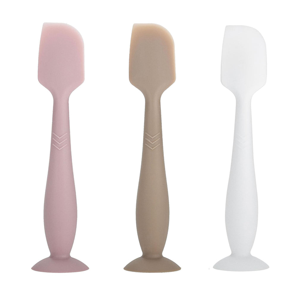 QYG diaper cream spatula with soft silicone tip applies ointment smoothly.