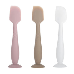 QYG diaper cream spatula with soft silicone tip applies ointment smoothly.