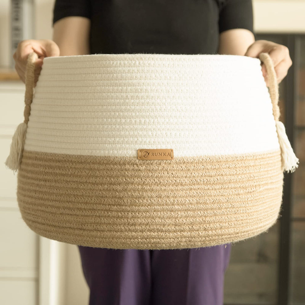 R RUNKA basket holding pillows and blankets for a cozy living space.