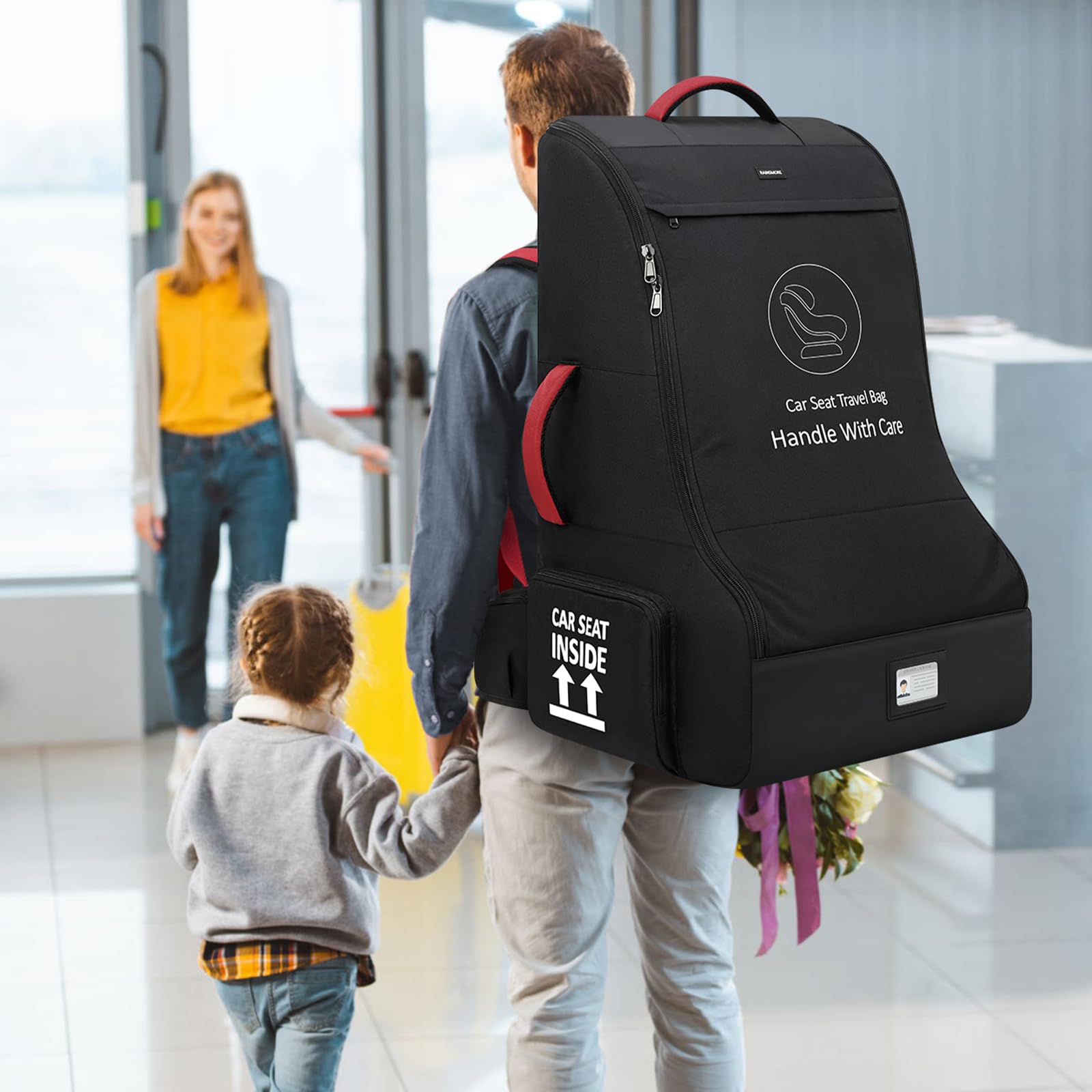 RAINSMORE airplane-ready car seat bag being carried hands-free.