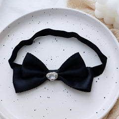 Rannyrena yellow velvet gloss bow headband adds sunny, playful touch for photos.