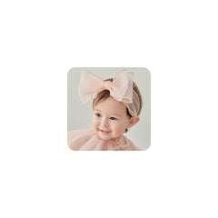 Rannyrena lace knot headband in pink D close up showing soft stretch for daily wear