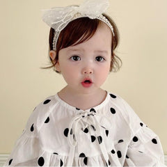 Rannyrena baby headband during a photo session for perfect framing