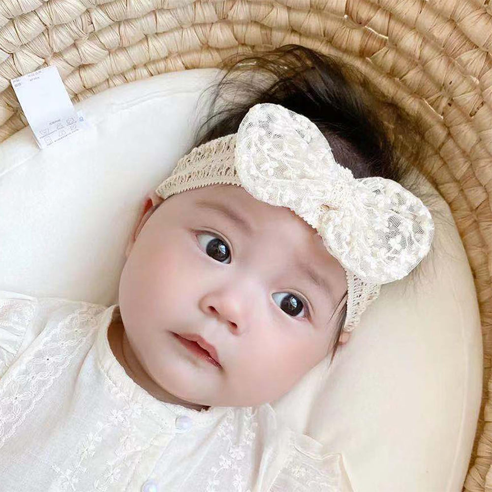 Rannyrena lace headband ivory worn during photoshoots for treasured memories.