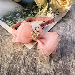 Rannyrena baby headband worn on a tiny head showing stretch fit