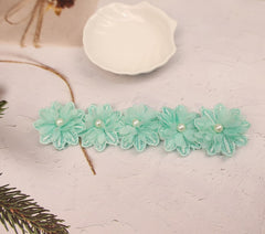 Rannyrena cyan floral design detail highlighting delicate lace and petals.