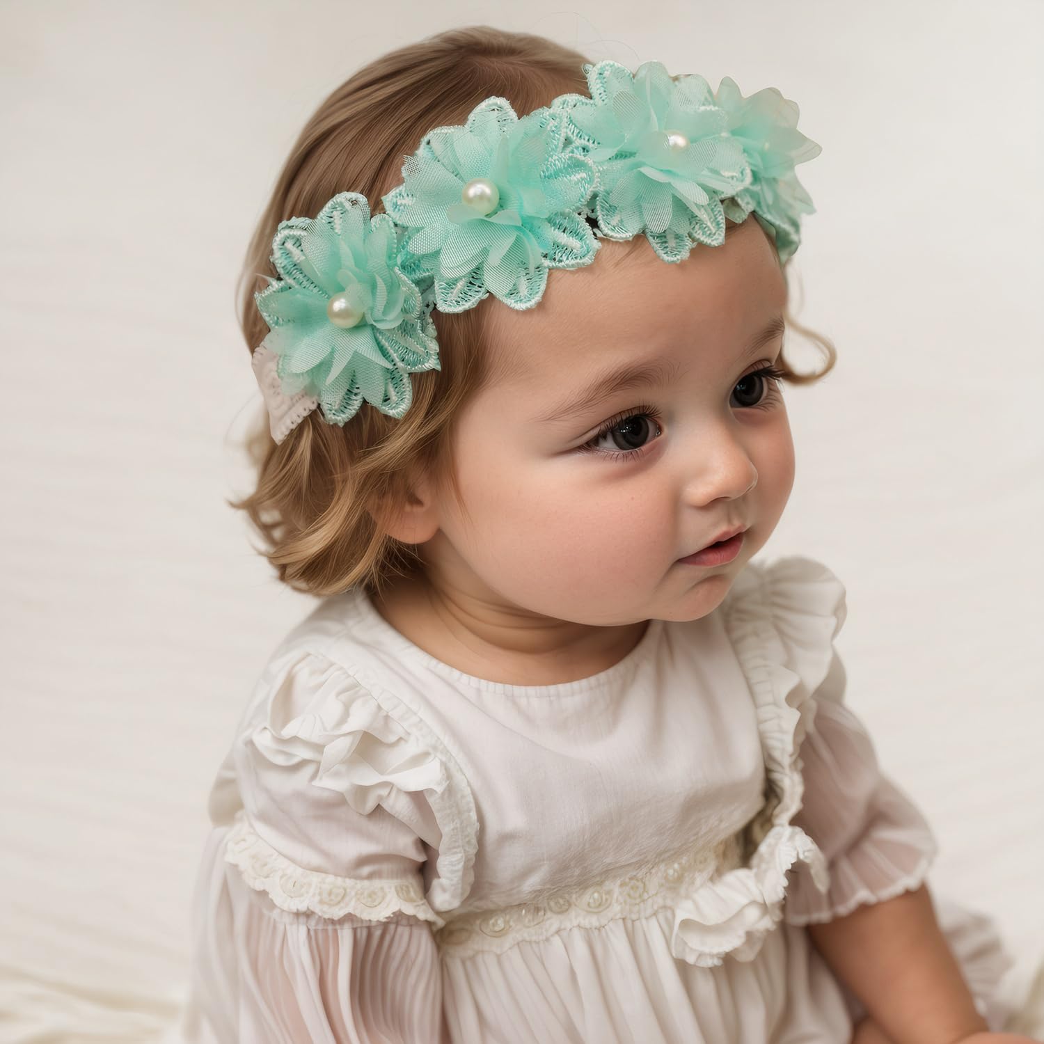 Rannyrena cyan headband on a baby showcasing floral elegance for everyday wear.
