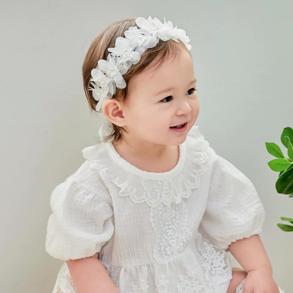 Rannyrena headband worn by baby for a photo-ready look