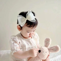 Rannyrena knotted headband for babies adds sweet style and comfort