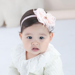 Rannyrena white lace headband with adjustable elastic for secure fit.