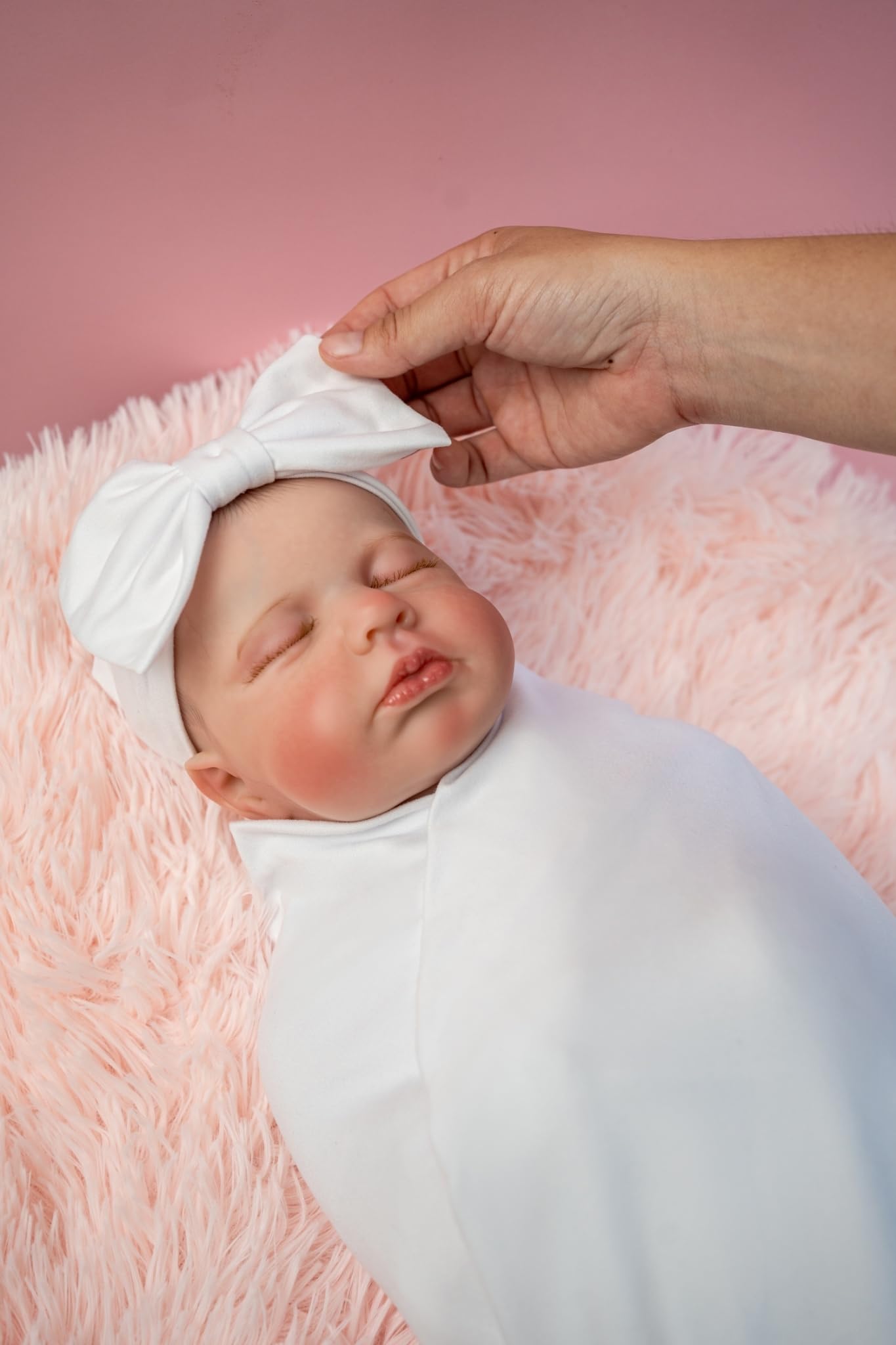 RATIVE headband cap closeup on newborn shows soft fabric and secure fit