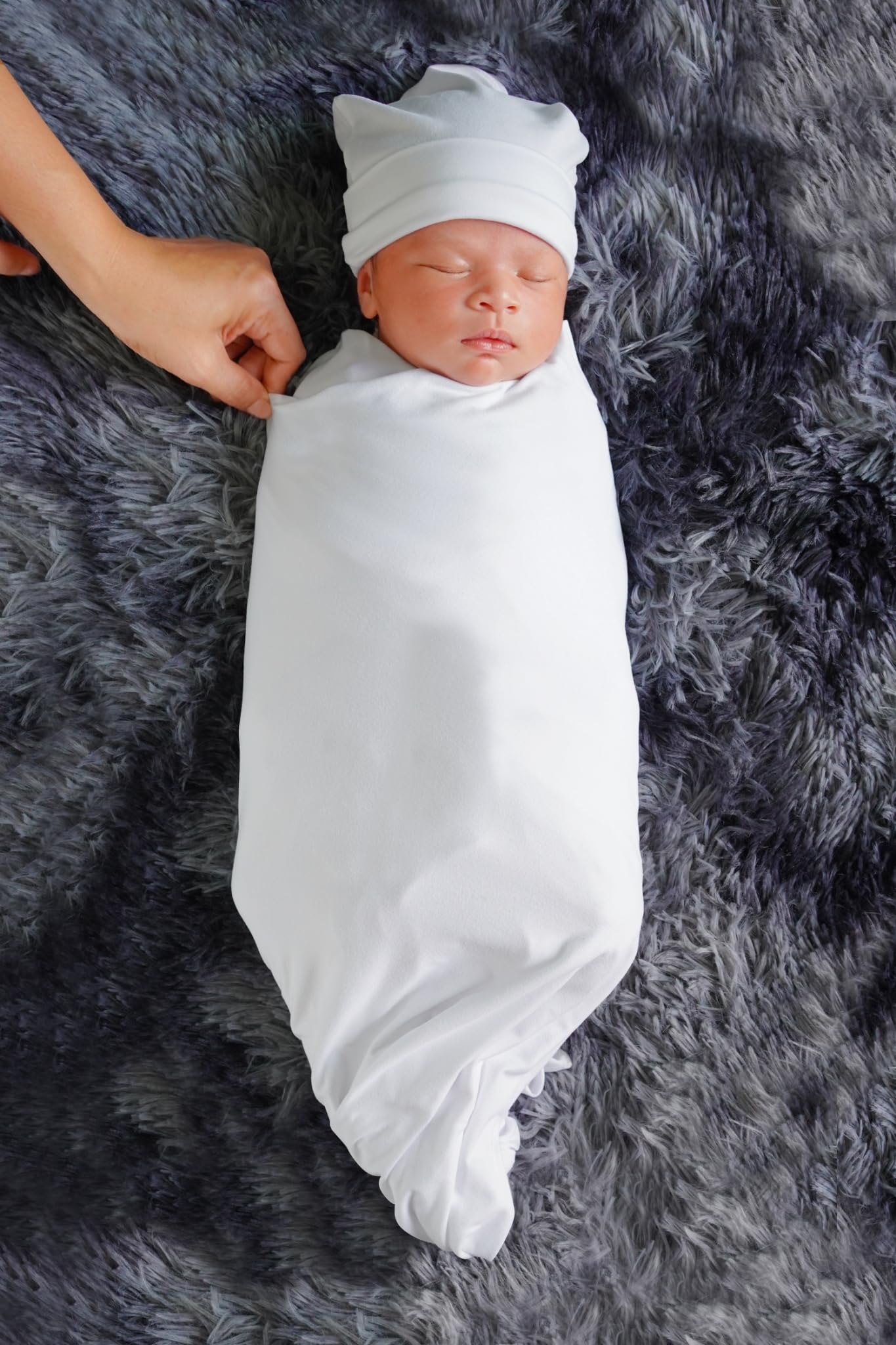 RATIVE stretchy swaddle wrap keeping limbs snug and secure for calmer moments